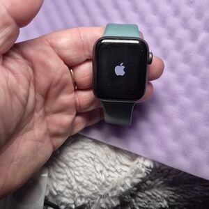 Apple Watch with Teal Green Sport Band